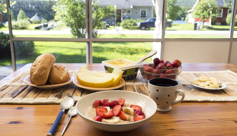 healthy Breakfast on sunny summer veranda